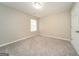 Neutral bedroom with carpeted floors and a window allowing natural light at 1577 Keystone Dr, Conley, GA 30288