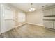 Cozy dining area with natural lighting, wood grain floors and decorative light fixture at 1577 Keystone Dr, Conley, GA 30288
