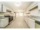 Bright kitchen featuring stainless steel appliances, neutral cabinets and granite countertops at 1577 Keystone Dr, Conley, GA 30288