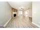 Bright living room with wood grain floors, stone fireplace, and neutral wall color at 1577 Keystone Dr, Conley, GA 30288