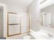 Bathroom with a shower and tub combo, single sink vanity, and a large mirror with lighting above at 182 Spivey Glen Dr, Jonesboro, GA 30236