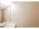 Clean bathroom featuring a single sink vanity, and a large mirror with a bar light above at 182 Spivey Glen Dr, Jonesboro, GA 30236