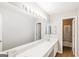 Bright bathroom featuring a double sink vanity with an enormous mirror at 182 Spivey Glen Dr, Jonesboro, GA 30236