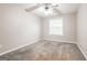Bedroom featuring carpeted floors, a ceiling fan, a window with blinds, and neutral paint at 182 Spivey Glen Dr, Jonesboro, GA 30236