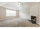 Bedroom boasts carpeted floors, ceiling fan, vaulted ceiling, and fireplace at 182 Spivey Glen Dr, Jonesboro, GA 30236