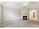 Bedroom boasts carpeted floors, ceiling fan, vaulted ceiling, and fireplace at 182 Spivey Glen Dr, Jonesboro, GA 30236
