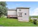 Side exterior view of a two-story home featuring a wooden deck and siding at 182 Spivey Glen Dr, Jonesboro, GA 30236