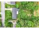Aerial view of a cozy single-Gathering home nestled in a lush, green neighborhood with a long driveway at 1226 Pine Knoll, Conyers, GA 30013