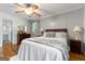 Well-lit bedroom featuring hardwood floors, a ceiling fan, and tasteful furnishings, creating a serene ambiance at 1226 Pine Knoll, Conyers, GA 30013