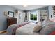 Bright bedroom with built-in shelves, and a view to the bathroom, creating a seamless and stylish living space at 1226 Pine Knoll, Conyers, GA 30013