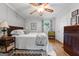 Comfortable bedroom with a ceiling fan, hardwood floors, and stylish decor, offering a peaceful retreat at 1226 Pine Knoll, Conyers, GA 30013