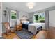 Cozy bedroom featuring natural light, hardwood floors, and neutral decor at 1226 Pine Knoll, Conyers, GA 30013