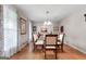 Dining room with hardwood floors, a glass table and an ornate chandelier at 1226 Pine Knoll, Conyers, GA 30013