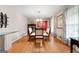 Spacious dining room featuring hardwood floors, adjacent seating area, and great natural light at 1226 Pine Knoll, Conyers, GA 30013