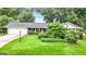 Charming single-story home with well-manicured lawn, mature trees and an attached two car garage at 1226 Pine Knoll, Conyers, GA 30013