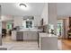 Bright, modern kitchen with white cabinets, stainless steel appliances, and quartz countertops at 1226 Pine Knoll, Conyers, GA 30013