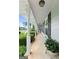 Covered front porch with white pillars and space for seating at 1226 Pine Knoll, Conyers, GA 30013