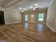 Bright living room showcases new hardwood floors, ceiling fans, fresh paint, and plenty of natural light at 518 Paynes Lake Rd, Carrollton, GA 30116