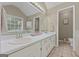 Bathroom featuring a large vanity with double sinks and tiled floors at 229 Lafayette St, Locust Grove, GA 30248