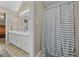 Spacious bathroom features a double sink vanity and tiled flooring at 229 Lafayette St, Locust Grove, GA 30248