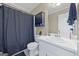 Cozy bathroom with a shower with a curtain, a toilet, and a sink at 229 Lafayette St, Locust Grove, GA 30248