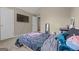 Neutral bedroom featuring a ceiling fan and walk-in closet at 229 Lafayette St, Locust Grove, GA 30248