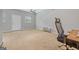 Bright bedroom offers neutral walls and lots of space with both a door and window at 229 Lafayette St, Locust Grove, GA 30248