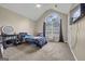 Bright bedroom with vaulted ceiling, large arched window, and closet at 229 Lafayette St, Locust Grove, GA 30248