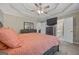 Comfortable main bedroom with gray walls, a ceiling fan and an en suite bathroom at 229 Lafayette St, Locust Grove, GA 30248