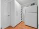 Walk-in pantry featuring ample shelving space, a refrigerator and an exterior door at 229 Lafayette St, Locust Grove, GA 30248