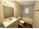 Updated bathroom with a modern vanity, tiled walls, and a shower-tub combination at 310 Flagstone Sw Dr, Atlanta, GA 30331