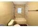 Freshly remodeled bathroom showcasing a sleek tub/shower, tiled walls, and updated fixtures at 310 Flagstone Sw Dr, Atlanta, GA 30331
