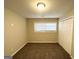 Comfortable bedroom with plush carpet, a closet, and a bright window at 310 Flagstone Sw Dr, Atlanta, GA 30331