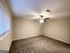 Spacious carpeted bedroom with neutral walls, ceiling fan and window blinds at 310 Flagstone Sw Dr, Atlanta, GA 30331