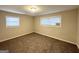Cozy bedroom with plush carpeting, natural light, and neutral tones at 310 Flagstone Sw Dr, Atlanta, GA 30331