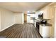 Well-lit kitchen and dining area featuring white cabinets, stainless appliances, and ample storage at 310 Flagstone Sw Dr, Atlanta, GA 30331