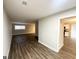 Bright living room with hardwood floors and an open layout leading to the kitchen at 310 Flagstone Sw Dr, Atlanta, GA 30331