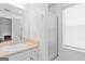 Clean bathroom features a well-lit vanity and shower with glass doors at 3005 Ryan Rd, Locust Grove, GA 30248