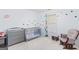 A delightful Bedroom includes a crib, changing table, glider, and rocking stool at 3005 Ryan Rd, Locust Grove, GA 30248