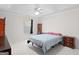 A comfortable bedroom featuring tray ceilings and neutral carpeting at 3005 Ryan Rd, Locust Grove, GA 30248