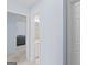 Inviting hallway view into the main bathroom with white vanity at 3005 Ryan Rd, Locust Grove, GA 30248
