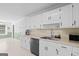 Bright kitchen featuring white cabinets, stainless steel appliances, and ample counter space at 3005 Ryan Rd, Locust Grove, GA 30248