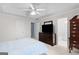 Spacious bedroom with tray ceiling, TV console, and access to the bathroom at 3005 Ryan Rd, Locust Grove, GA 30248