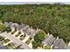 A bird's-eye view reveals homes surrounded by lush trees, offering a peaceful and nature-filled residential environment at 737 Shadow Lake Dr, Lithonia, GA 30058