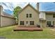 Back of home with deck, grassy area, with an air conditioning unit visible at 737 Shadow Lake Dr, Lithonia, GA 30058