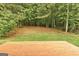 A wooden deck with a view of the forest. A perfect retreat for nature lovers at 737 Shadow Lake Dr, Lithonia, GA 30058