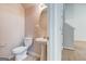Cozy powder room with pedestal sink, oval mirror and neutral color scheme providing functionality and comfort at 737 Shadow Lake Dr, Lithonia, GA 30058