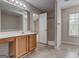 Bathroom with vanity, shower, tub, and tile flooring at 737 Shadow Lake Dr, Lithonia, GA 30058