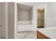 Well-lit en-suite bathroom with soaking tub, shower, tile flooring, and walk-in closet at 737 Shadow Lake Dr, Lithonia, GA 30058