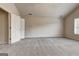 Bright, spacious bedroom featuring neutral walls, carpet, and vaulted ceilings at 737 Shadow Lake Dr, Lithonia, GA 30058